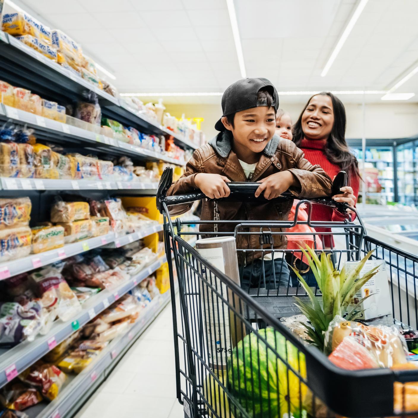 Kids with a trolley in a supermaket