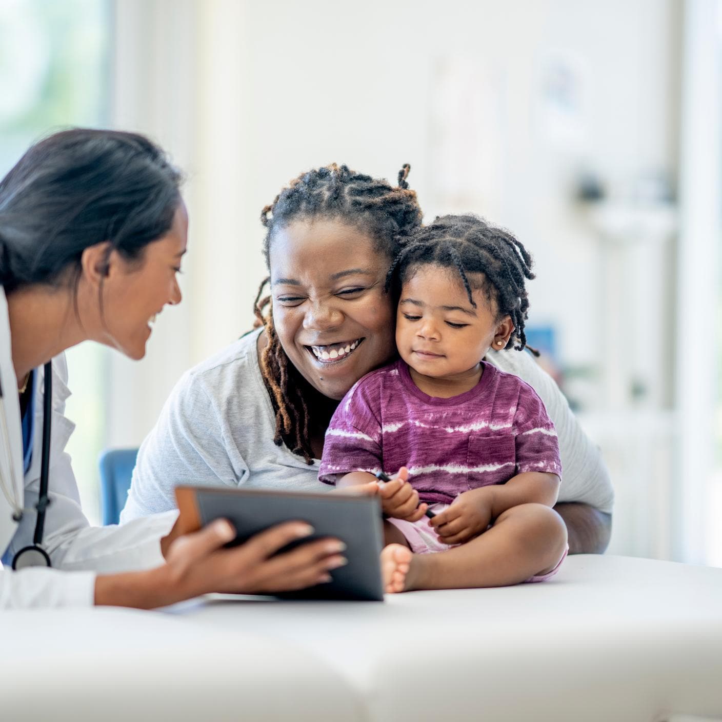 A young Mother and her son visit the doctor together 