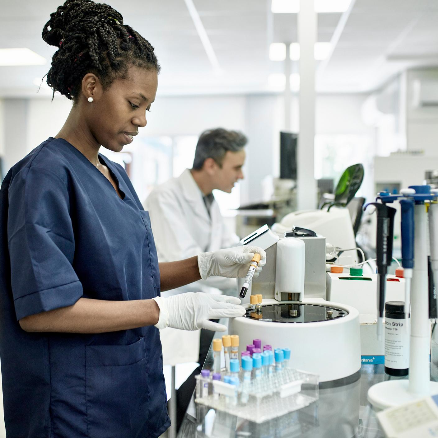 A forensic black woman working in a lab
