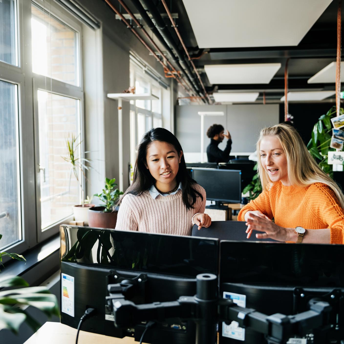 2 women working in office 