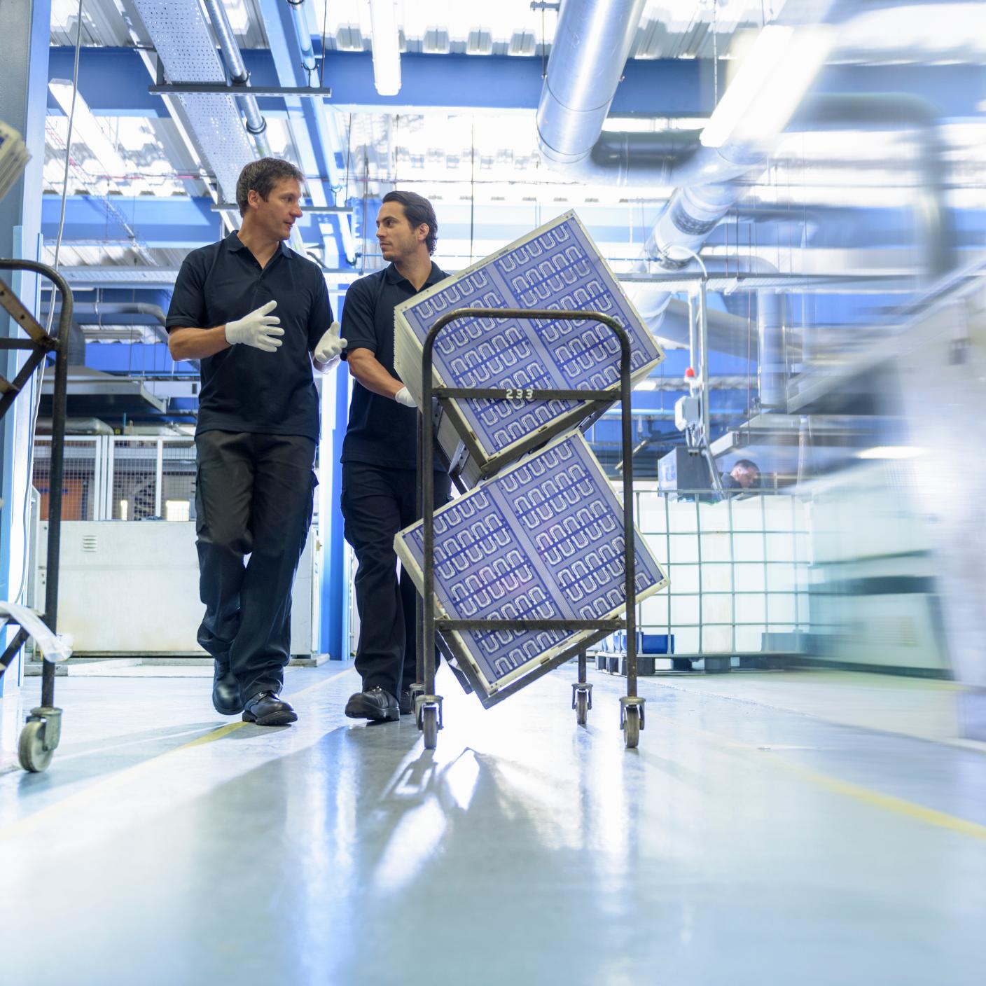 Workers in circuit board manufacturing factory