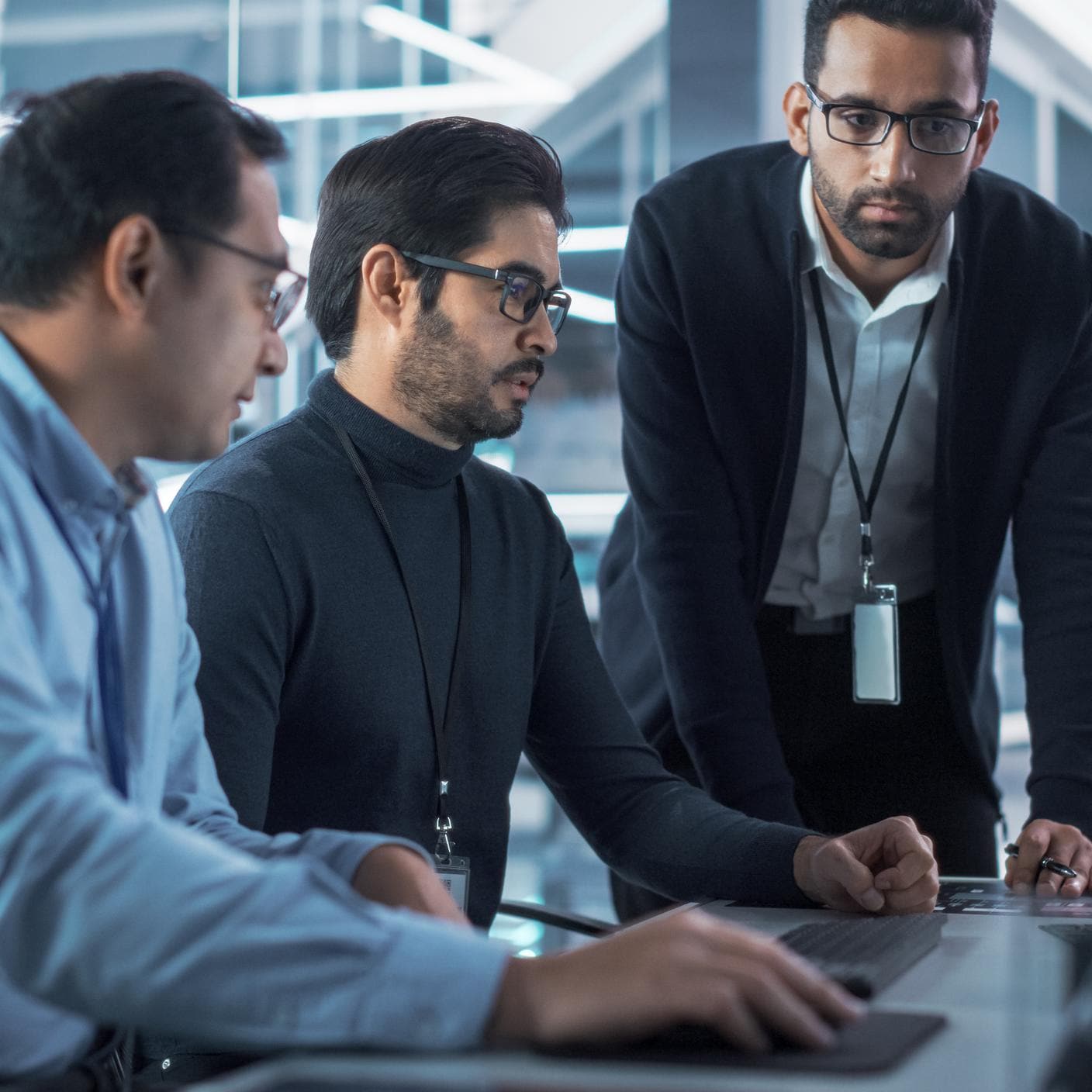 Colleagues in a meeting in front of a  computer