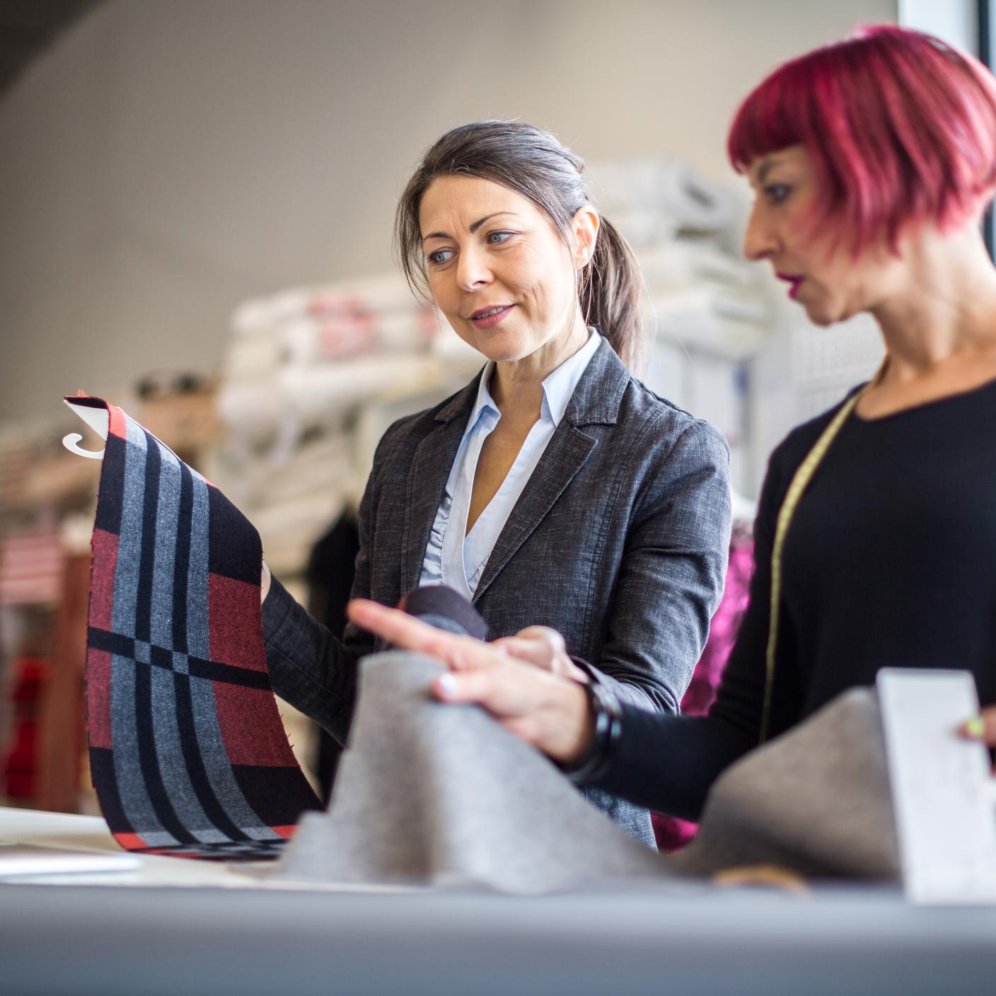 Instilling confidence in domestic furniture and quality fabric with BSI Kitemark™ - Two women checking fabrics