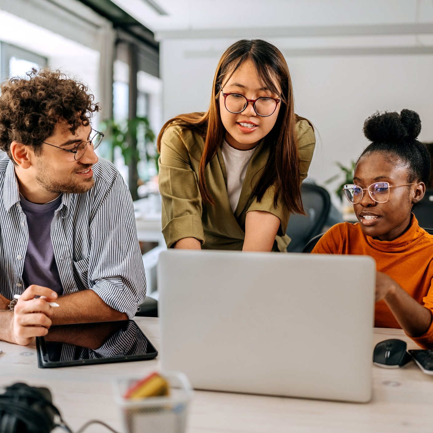 Manager working with team in a modern office