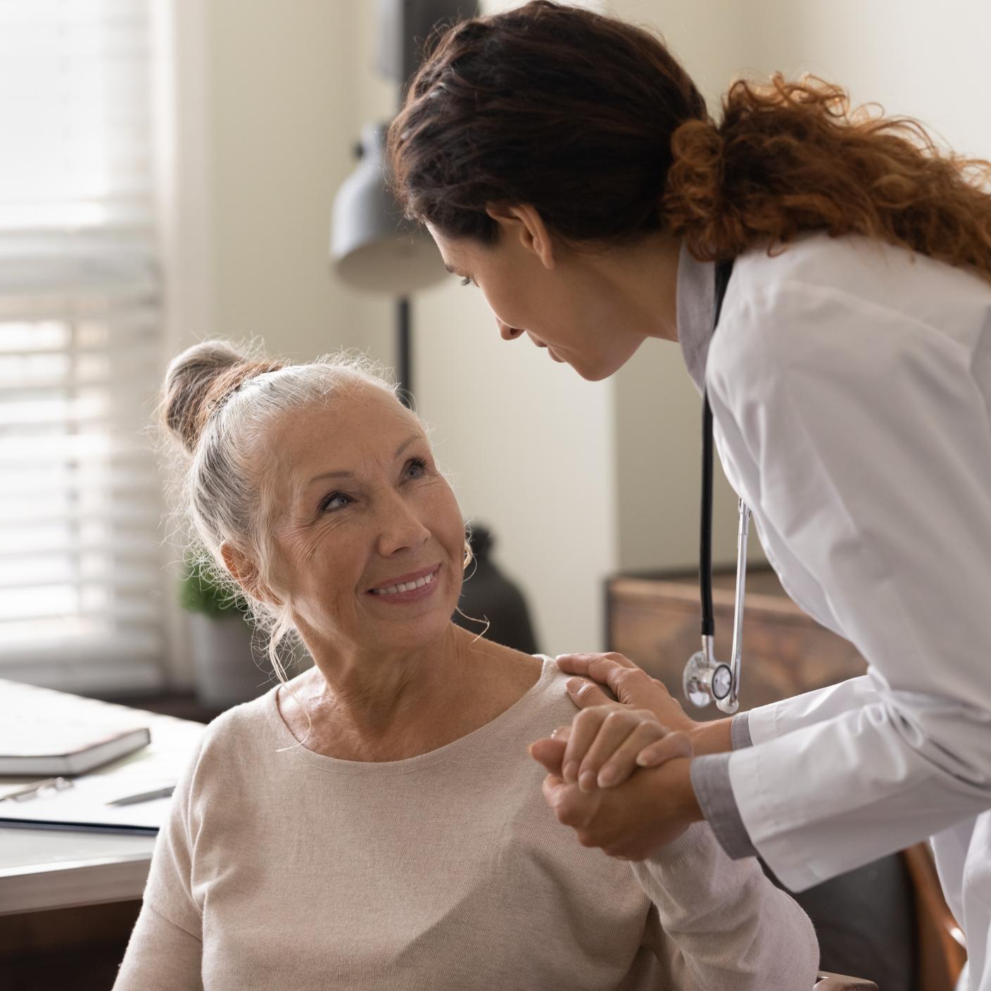 Elderly lady and doctor chatting 
