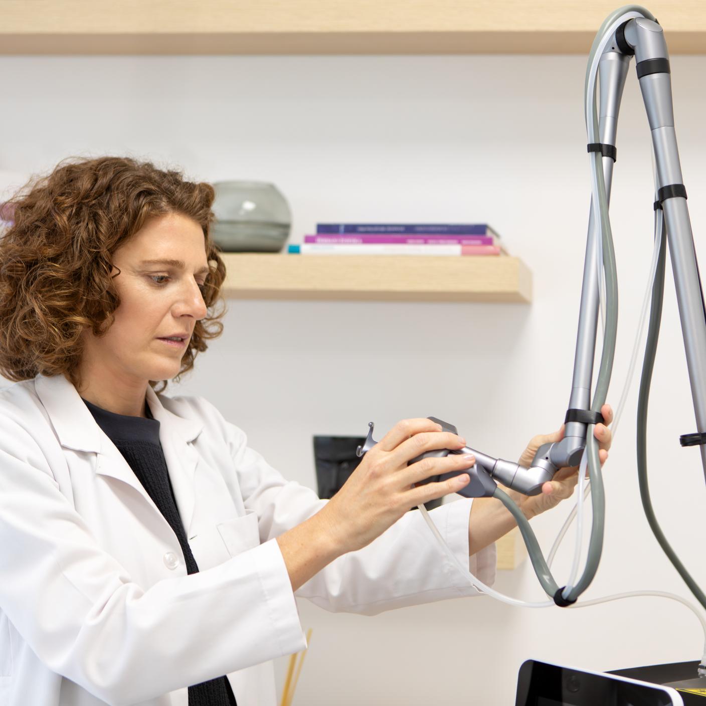 Female dermatologist doctor in her office at a dermatology and aesthetic clinic.