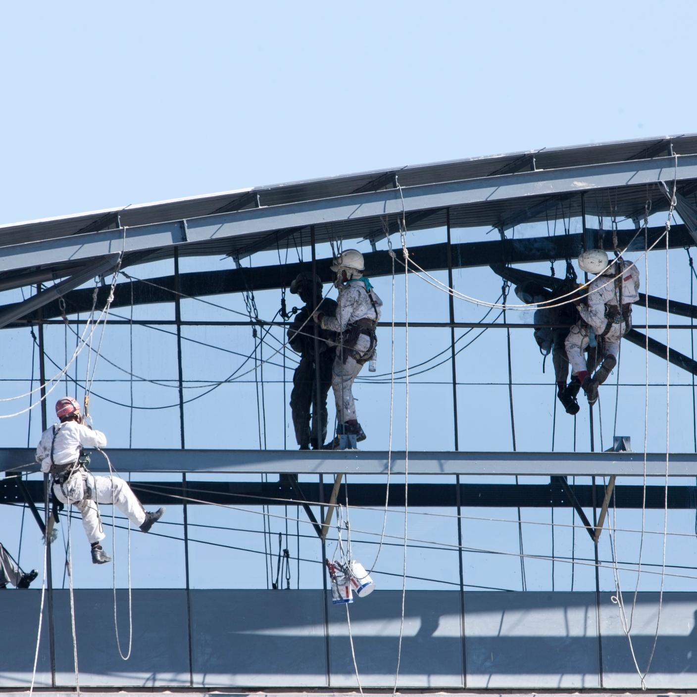 Men working on side of building.