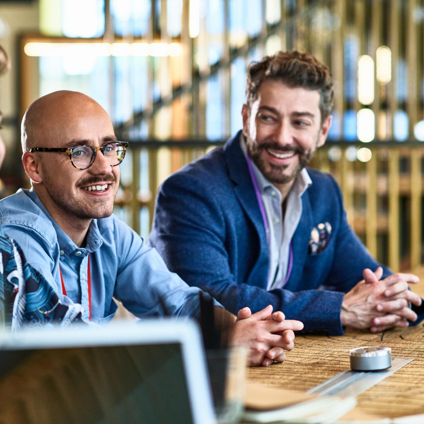 Cheerful businessmen in planning and strategy meeting.