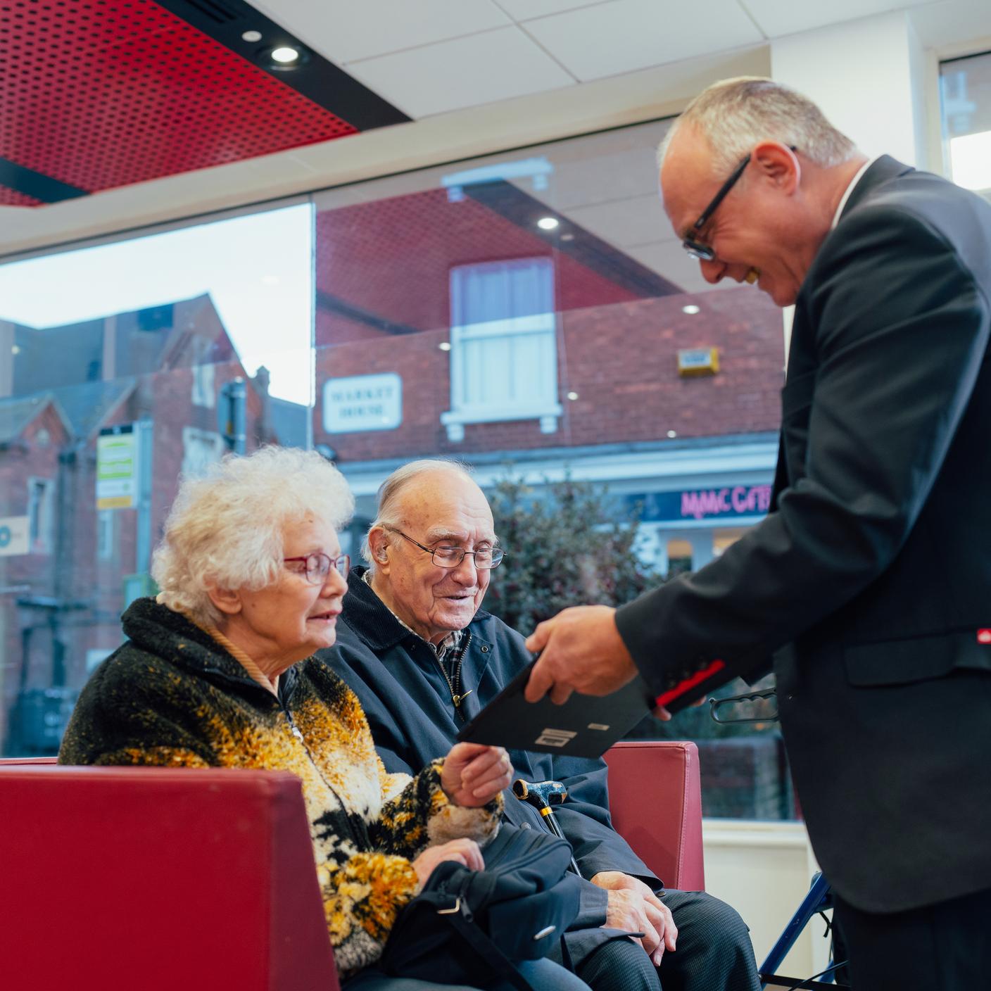 elderly people at the bank