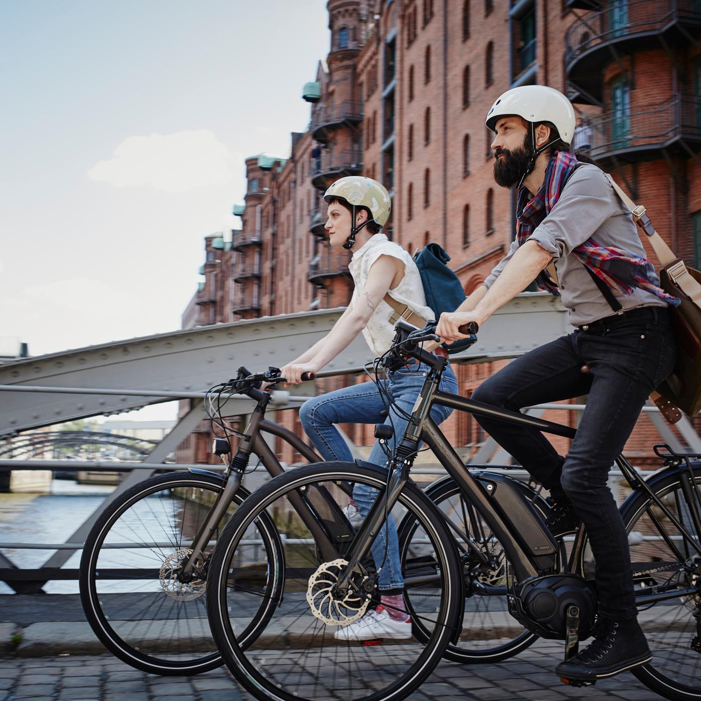 A couple riding electric bicycles