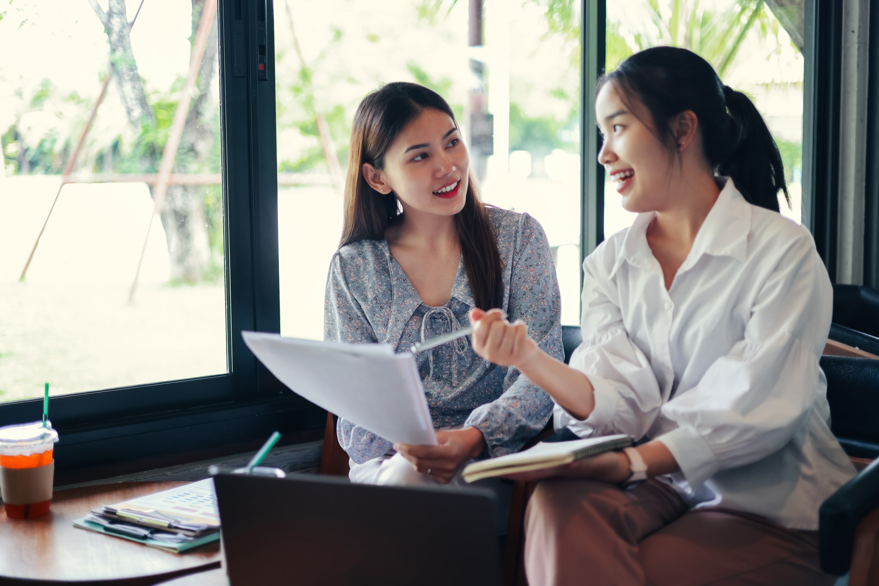 2 people looking at a paper document