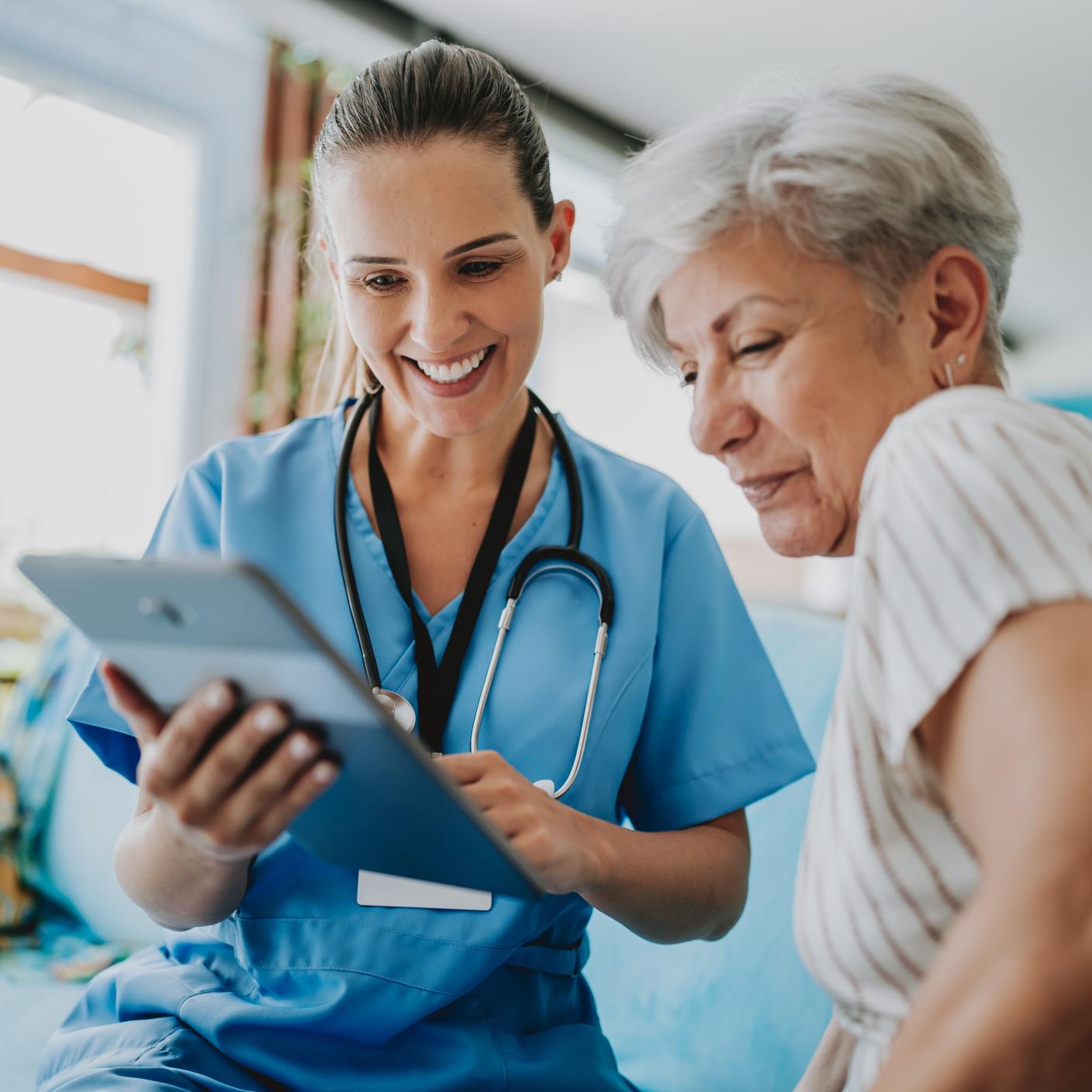 Home care healthcare professional using digital tablet.