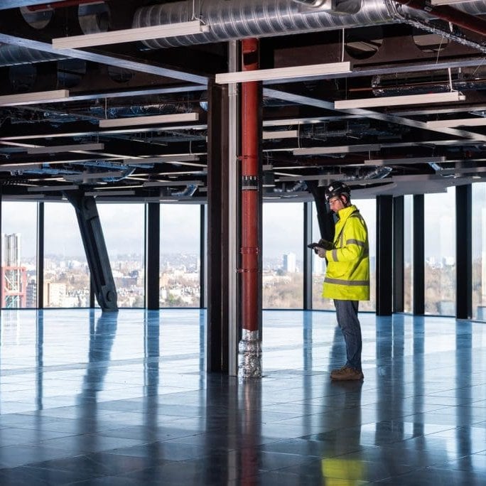 Kilnbridge UK infrastructure project photo. Man in high vis and safety gear on construction site