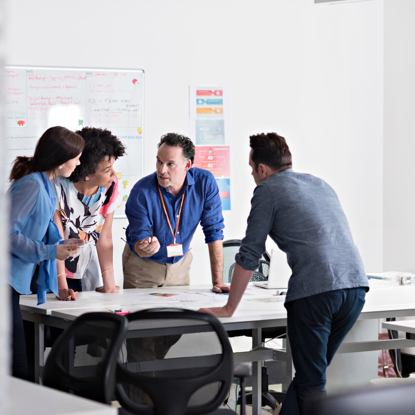 Business people having meeting in tech start-up office, emergency response safety planning, urgent meeting plan