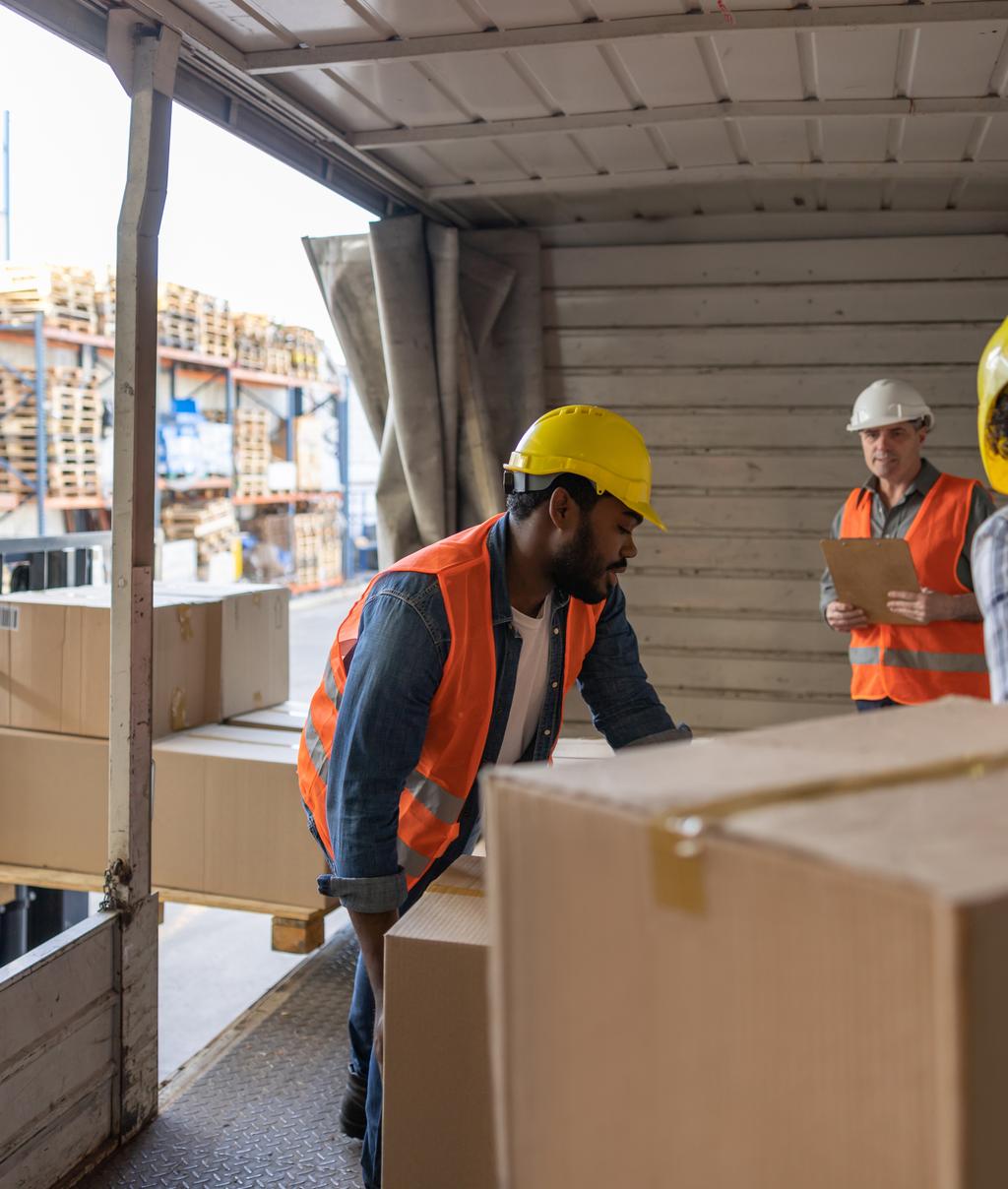 Transforming Aidtrust - Latin American workers loading a truck