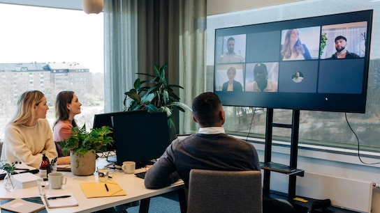Employees doing video conferencing