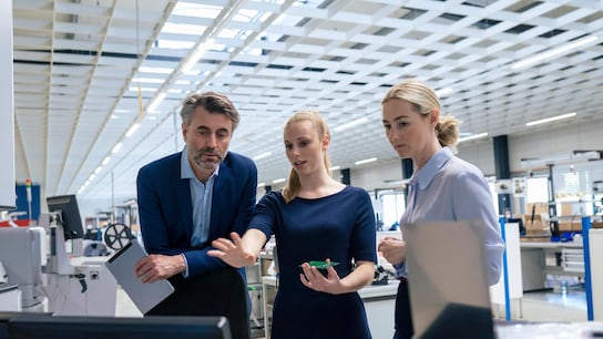 A group of employees discussing