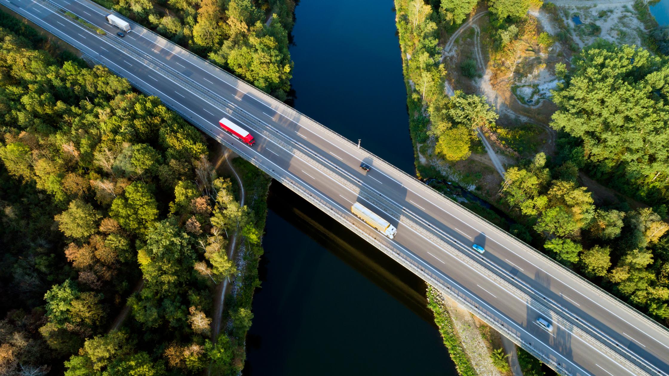 Supply chain in food and retail - Aerial view of highway bridge over Danube River, Bavaria, Germany