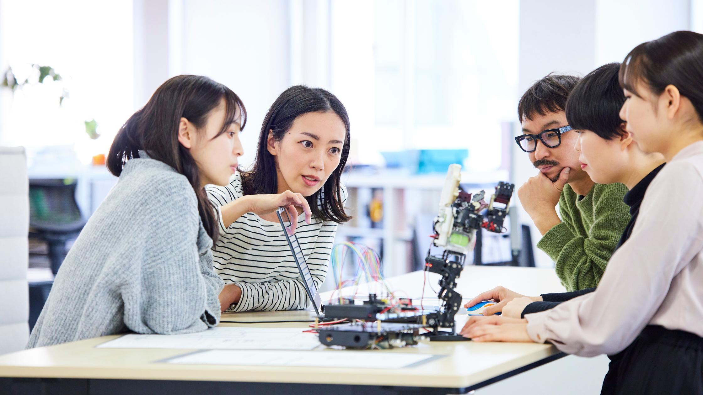 Future of trust - Robotics research and development team having a meeting