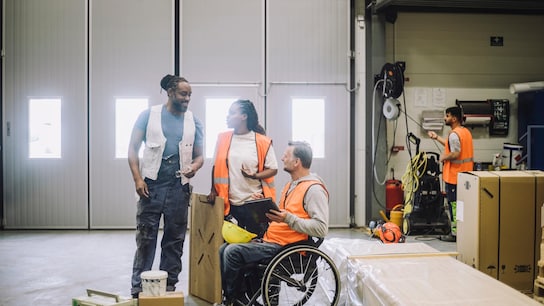 health safety wellbeing carpenter sitting on wheelchair