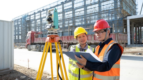 Engineers measure at a construction site
