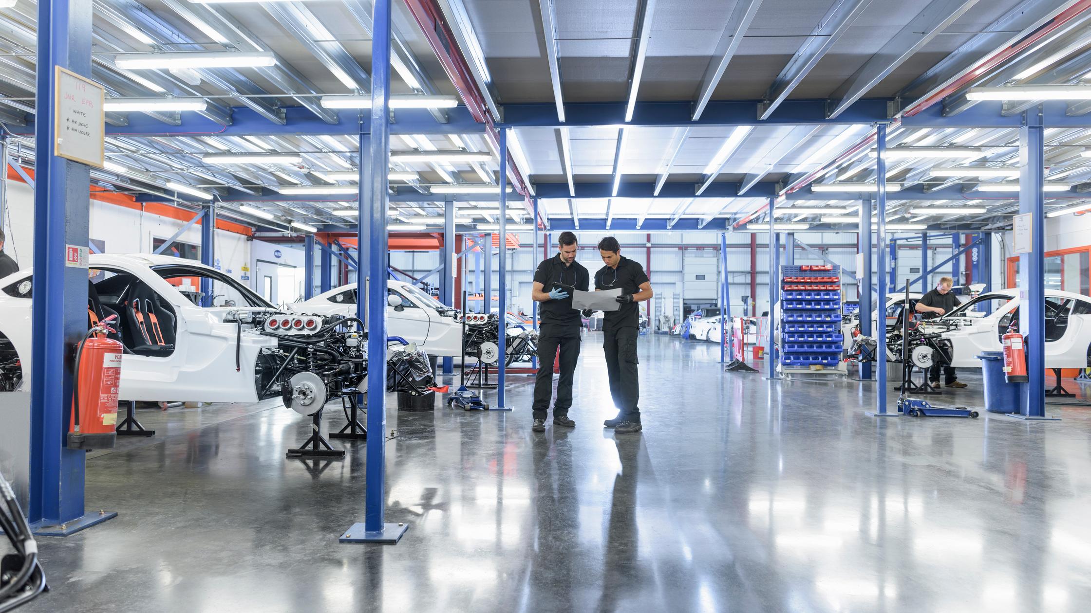 Automotive - Engineers in racing car factory