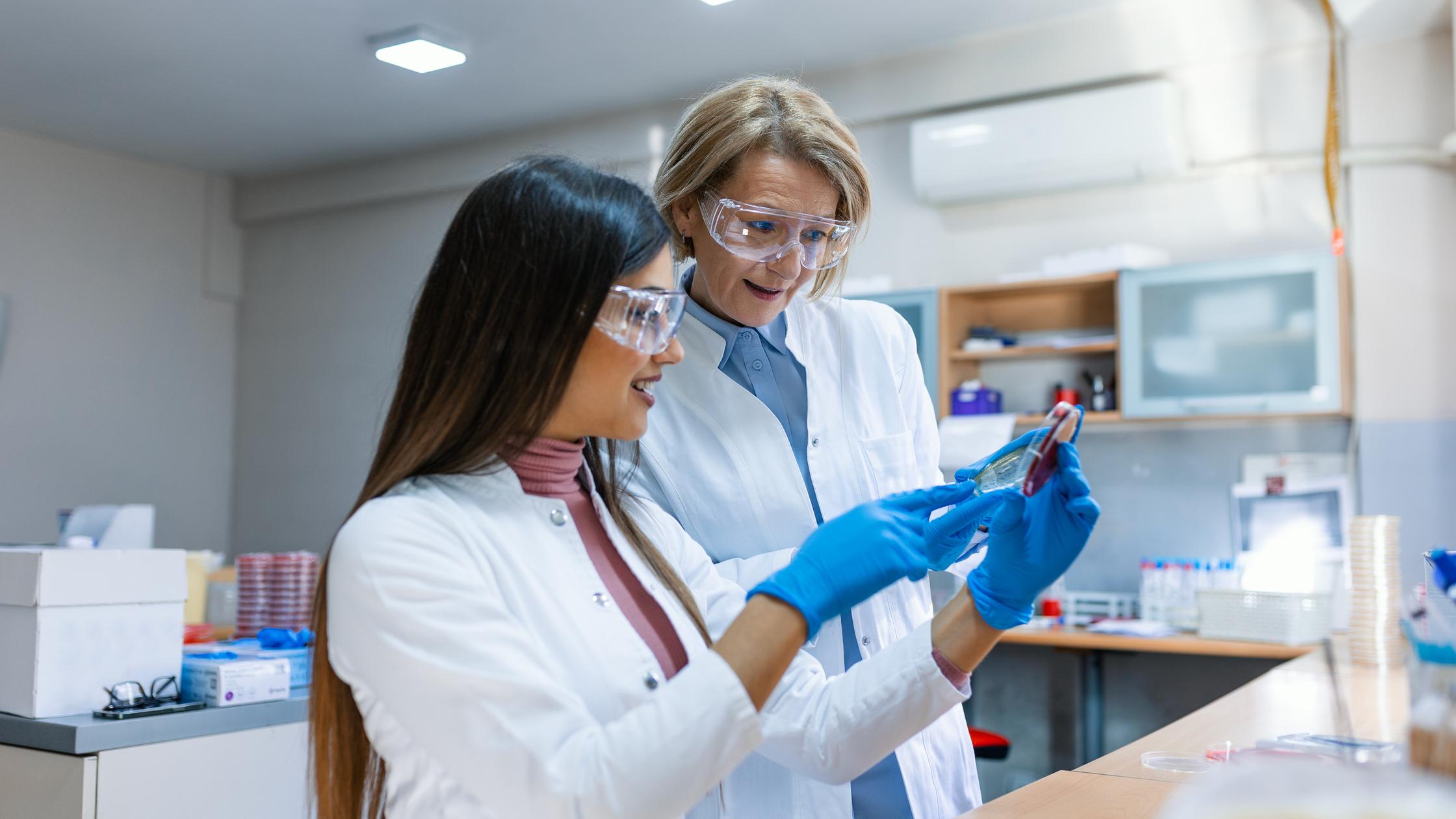 Two women with medical gloves