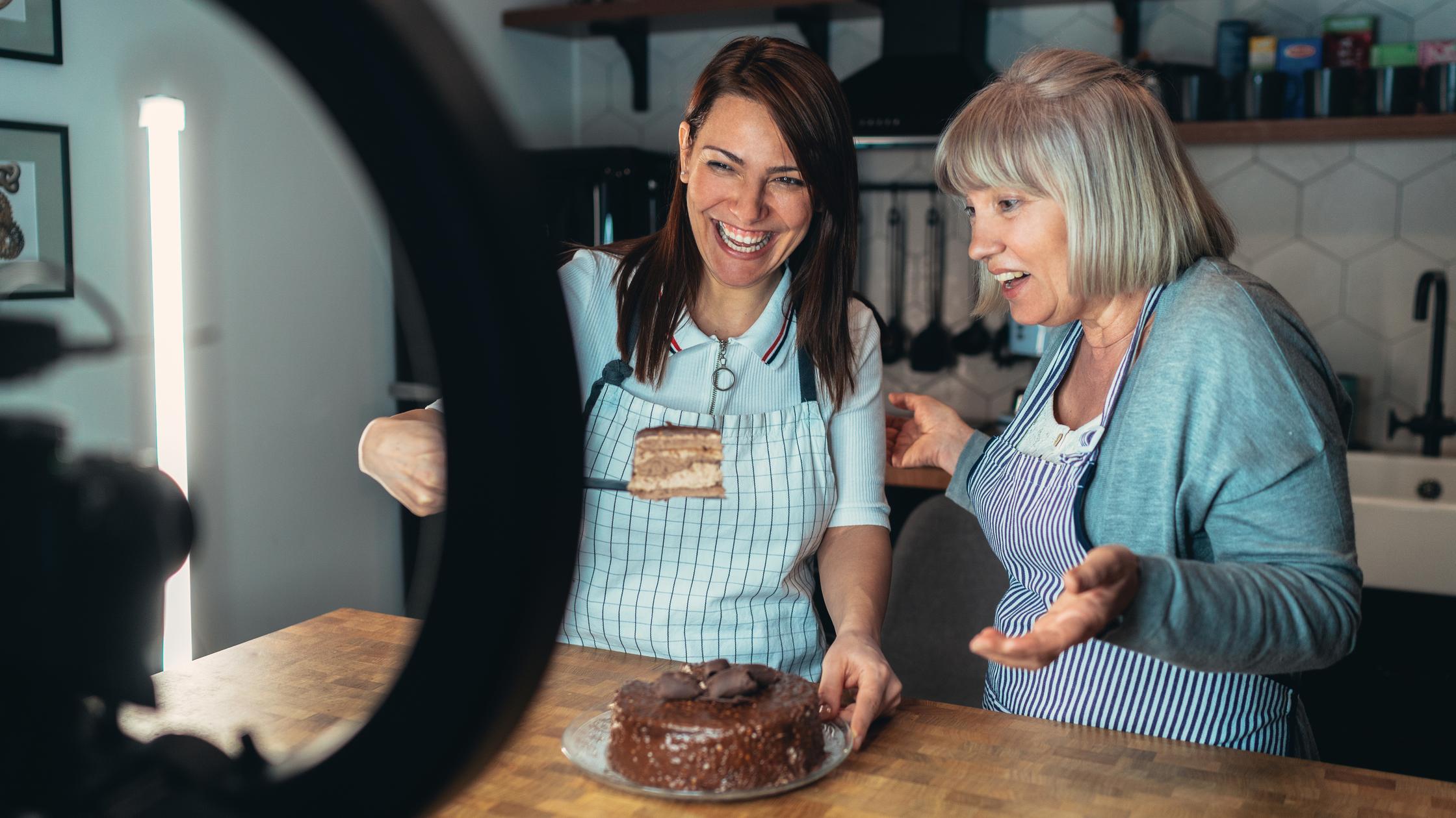 Woman vlogger recording video for food channel baking cake