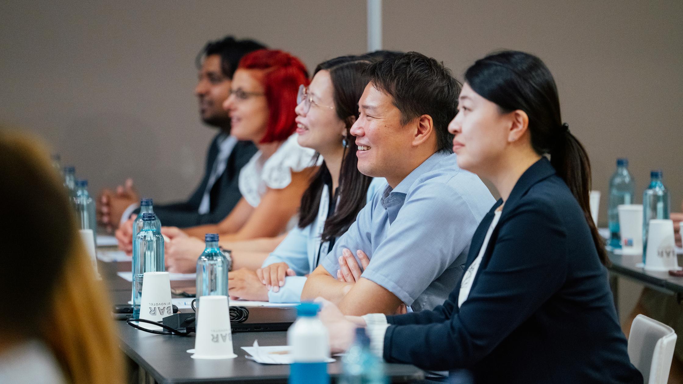 our people story - asian people smiling listening