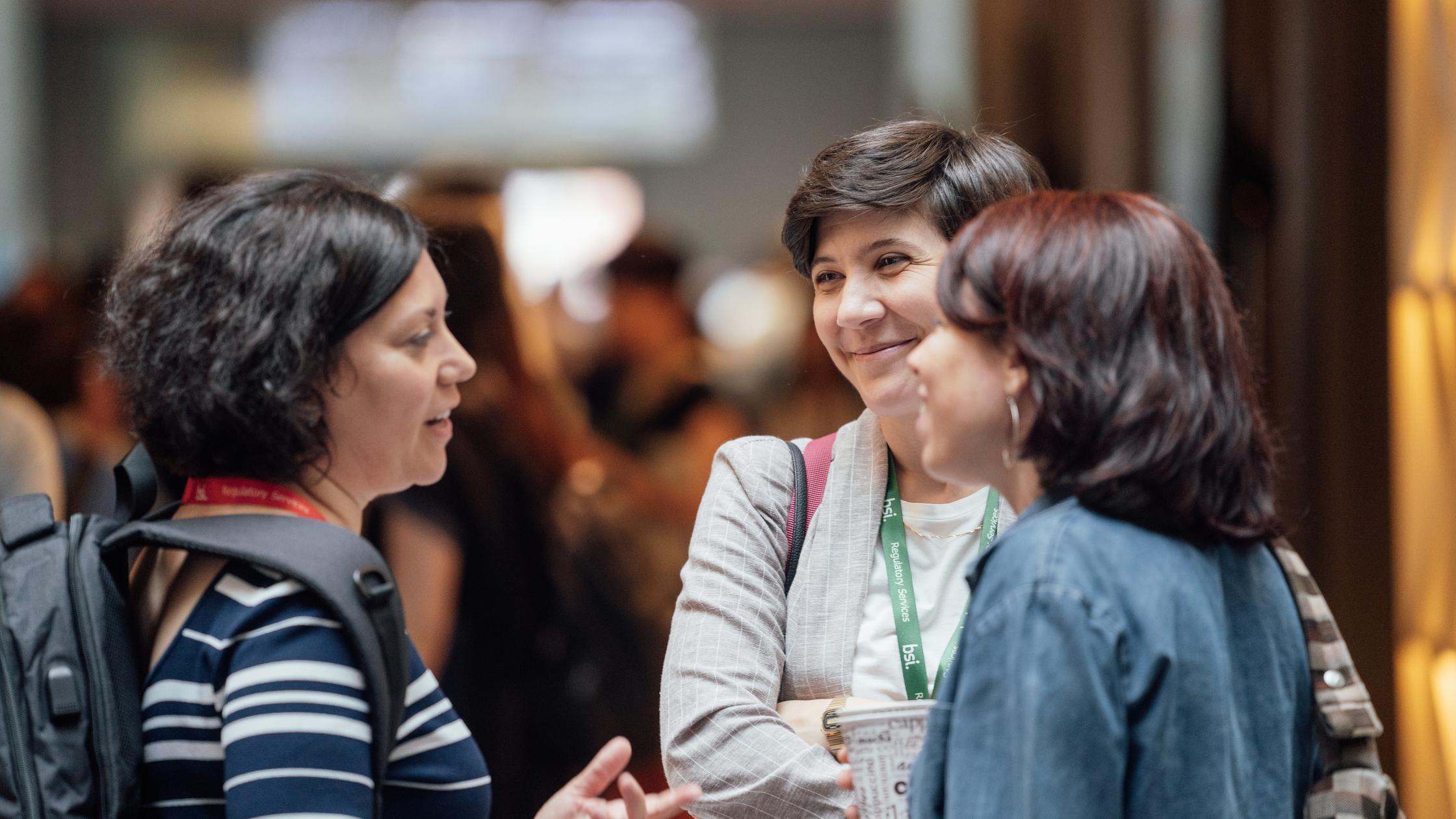 our people history - females discussing at conference