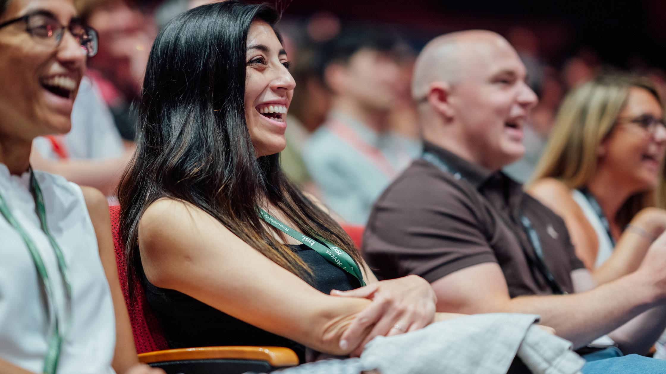 Smiling audience at presentation