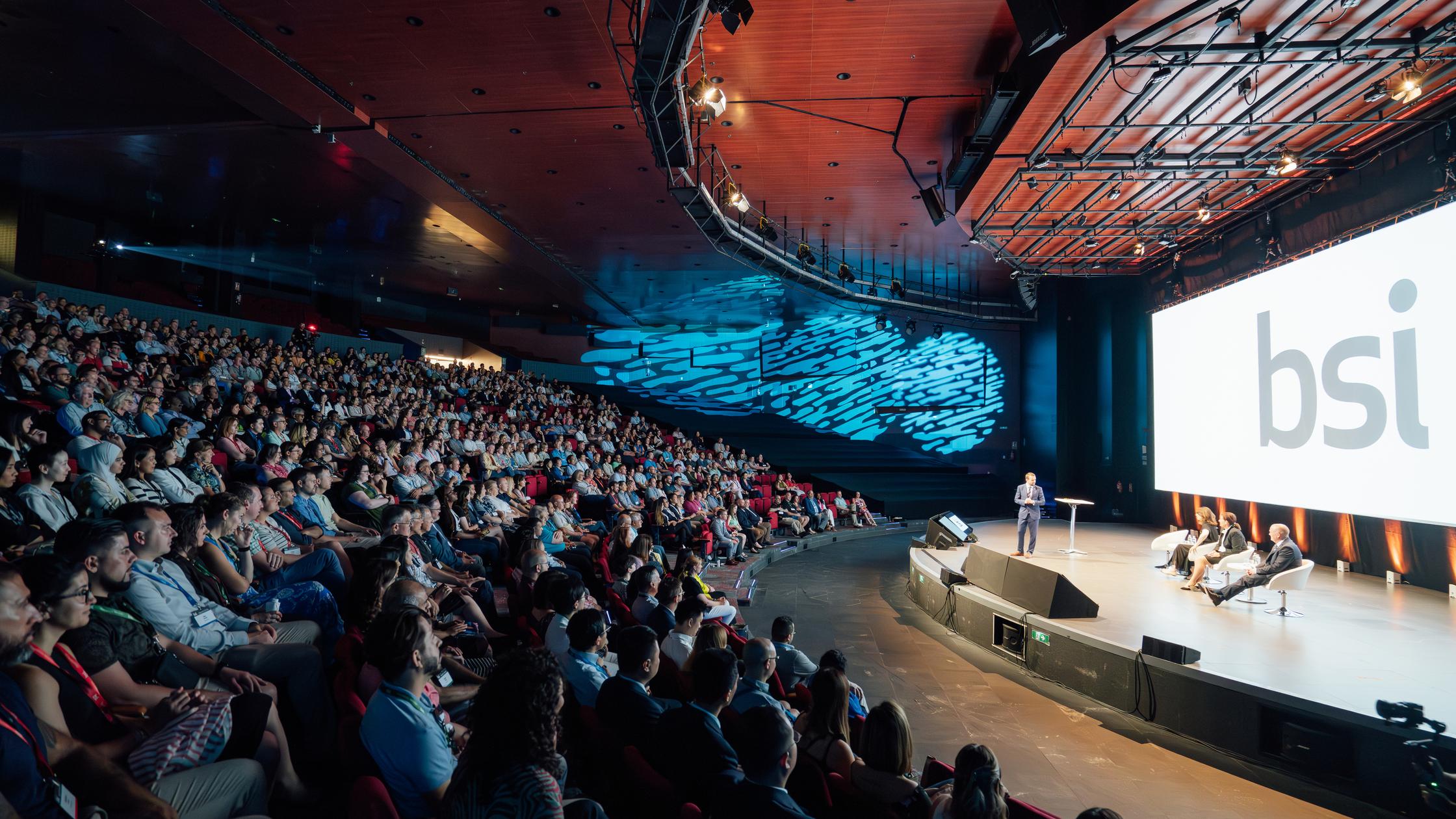 Crowd seated for a conference event