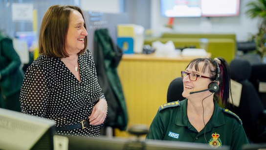 Paramedic workers discussing in a office