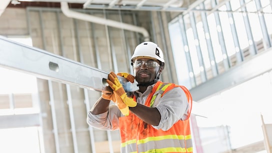 Man working carrying beam